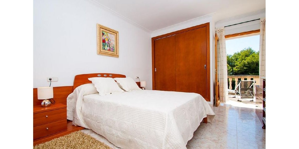 Beautiful White Double Bedroom with large comfortable bed and sunny terrace.