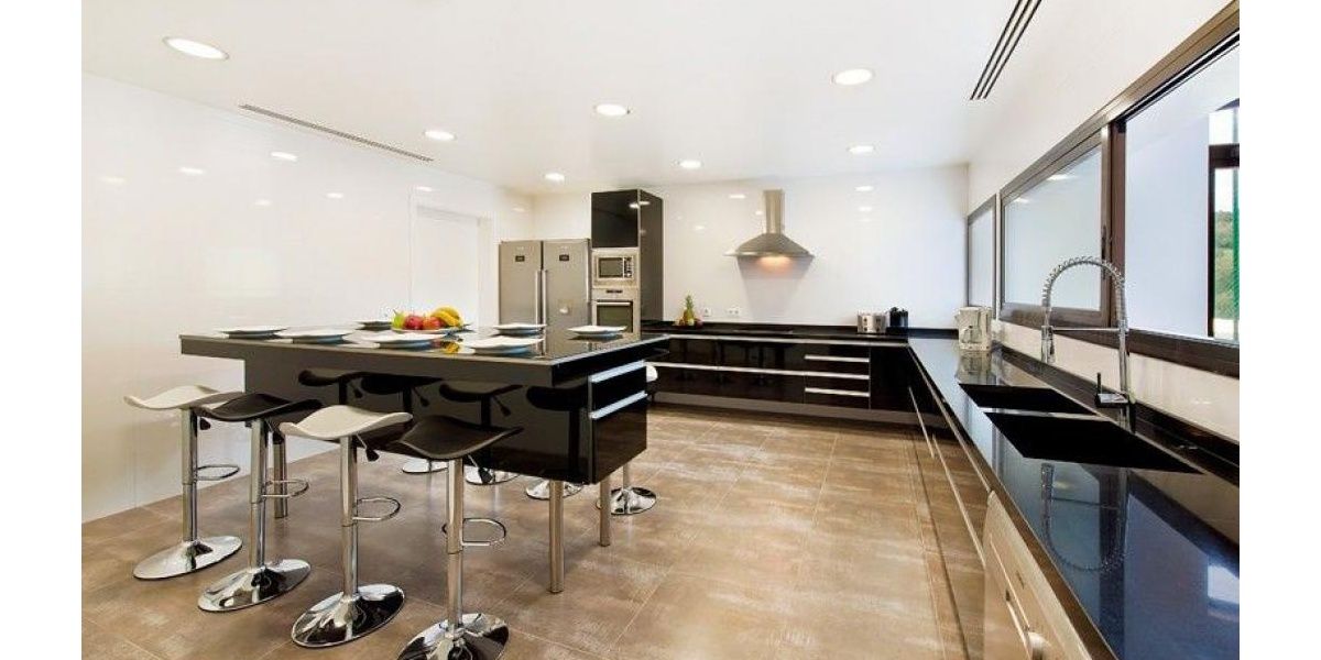 Amazing and equipped kitchen of contemporary design and stainless steel.