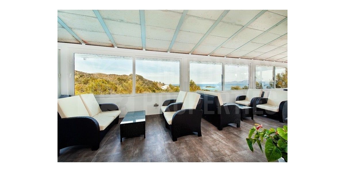 Panoramic views from the terrace area with comfortable sofas and coffee tables.