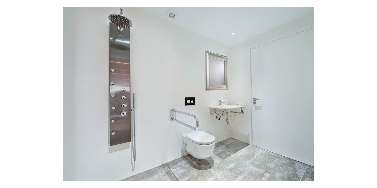 Spacious bathroom with shower adapted for people with disabilities.