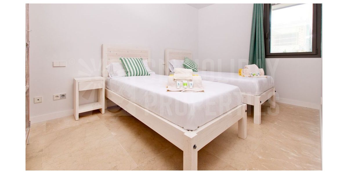 Double bedroom with two single beds.